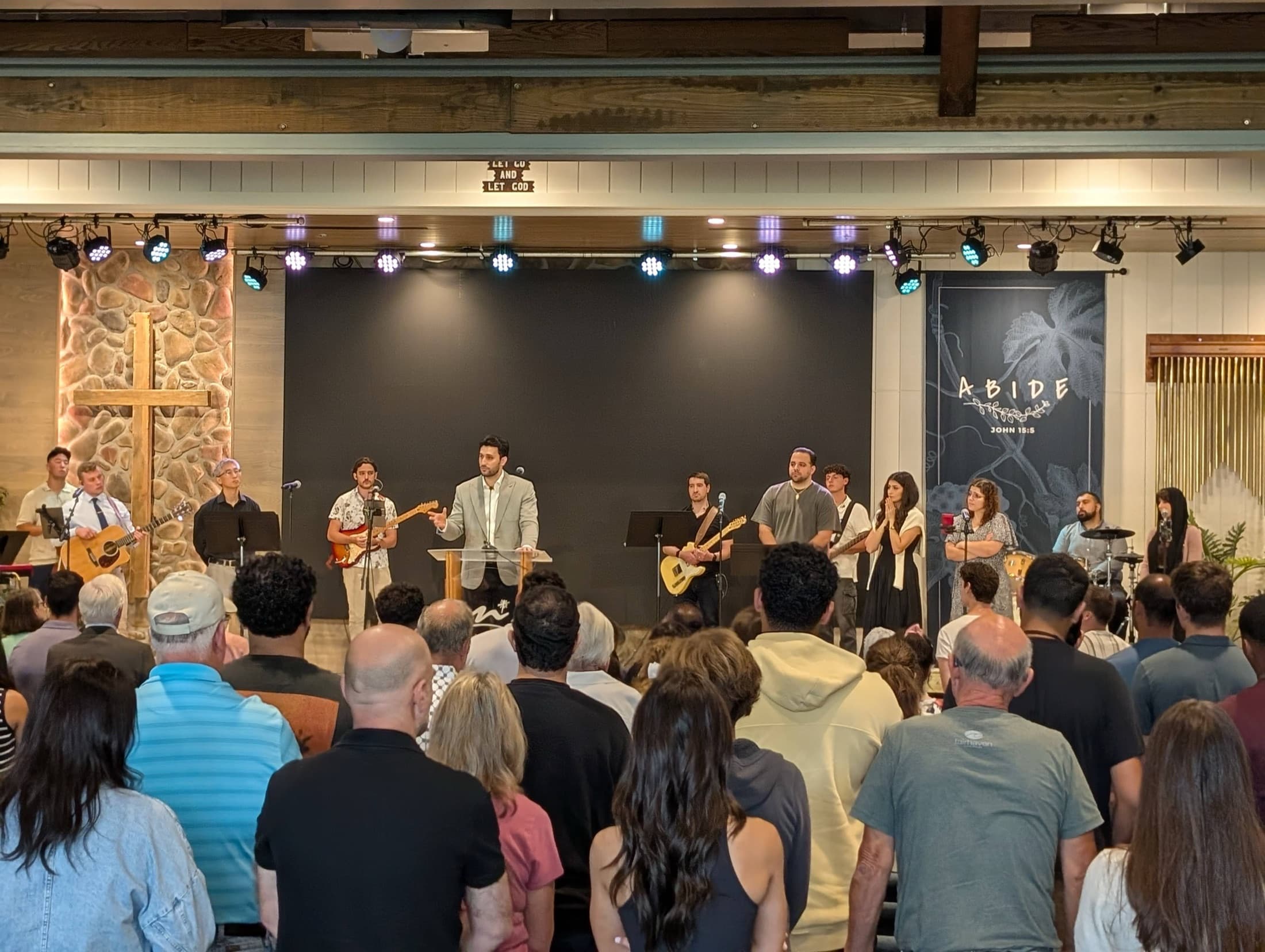 Hundreds of young adults worshiping together at the Maranatha Shabiba Conference